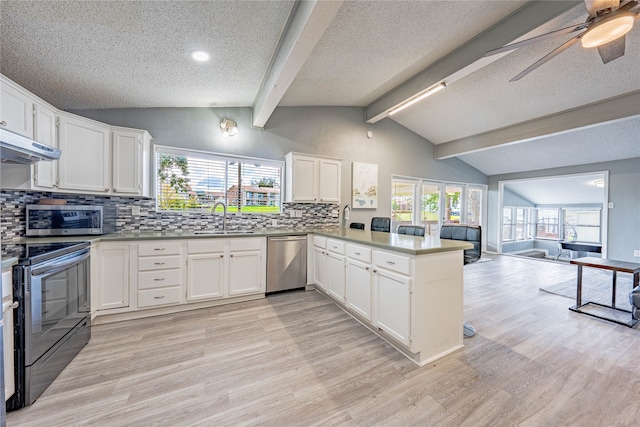 kitchen featuring appliances with stainless steel finishes, lofted ceiling with beams, white cabinets, kitchen peninsula, and ceiling fan