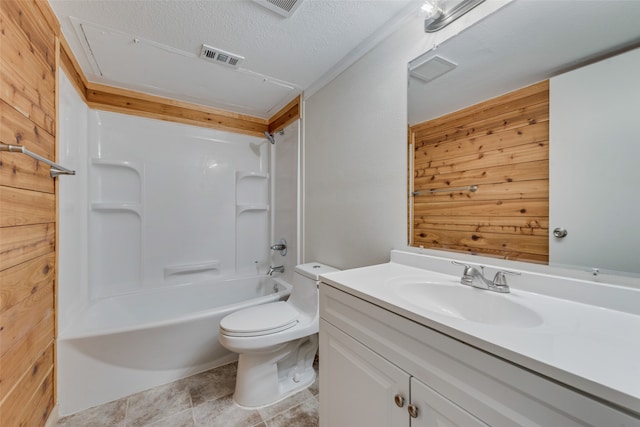 full bathroom with a textured ceiling, vanity, shower / washtub combination, wood walls, and toilet