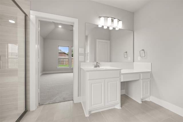 bathroom featuring lofted ceiling, tile patterned flooring, vanity, and a shower with shower door