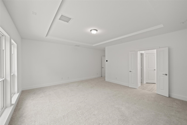 empty room with light colored carpet