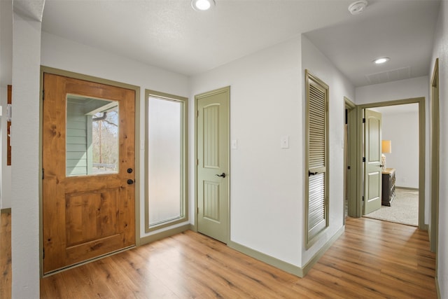 entrance foyer with light hardwood / wood-style floors