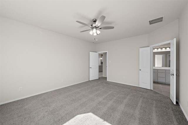 kitchen with stainless steel appliances, a kitchen island with sink, sink, white cabinets, and hanging light fixtures