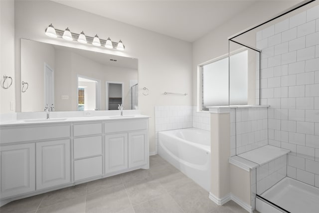 bathroom featuring separate shower and tub, tile patterned flooring, and vanity