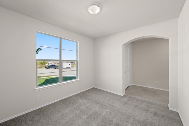 empty room with light colored carpet