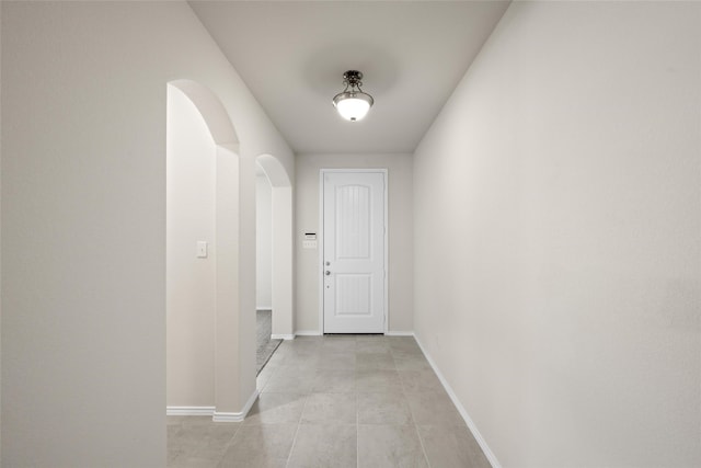 corridor with light tile patterned floors