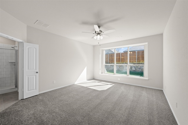 carpeted empty room with ceiling fan