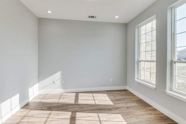 spare room featuring light wood-type flooring