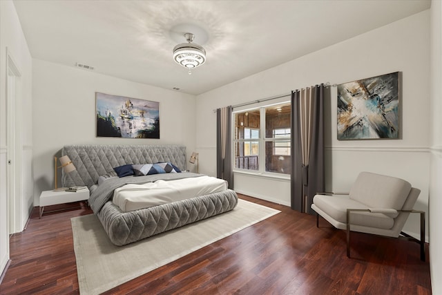 bedroom featuring dark hardwood / wood-style flooring