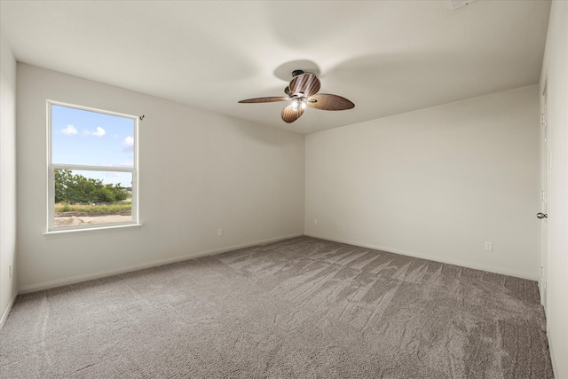 carpeted empty room with ceiling fan