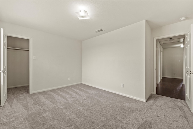 unfurnished bedroom featuring light colored carpet