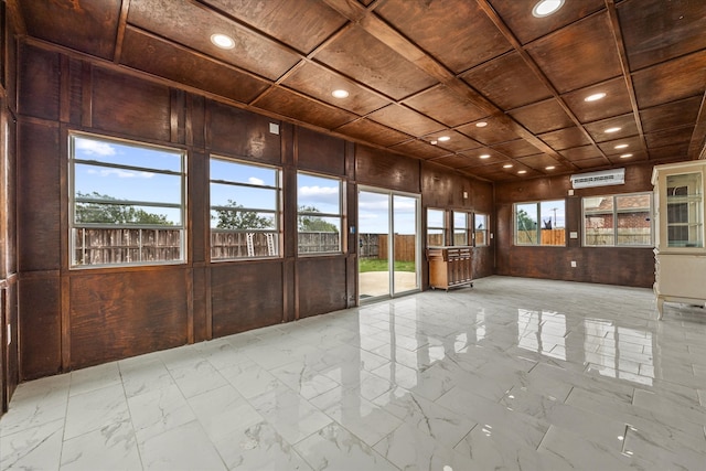 empty room featuring wood walls, a wall mounted air conditioner, and wooden ceiling