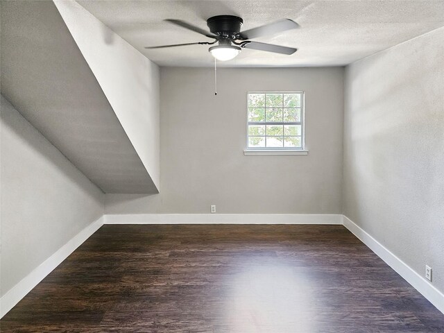 spare room with a textured ceiling, wood-type flooring, and ceiling fan