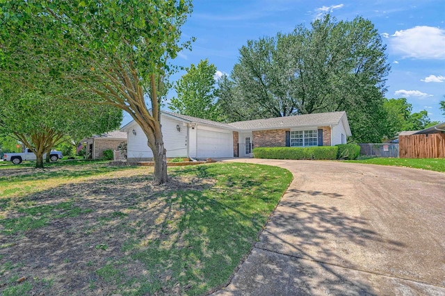 single story home featuring a garage and a front lawn