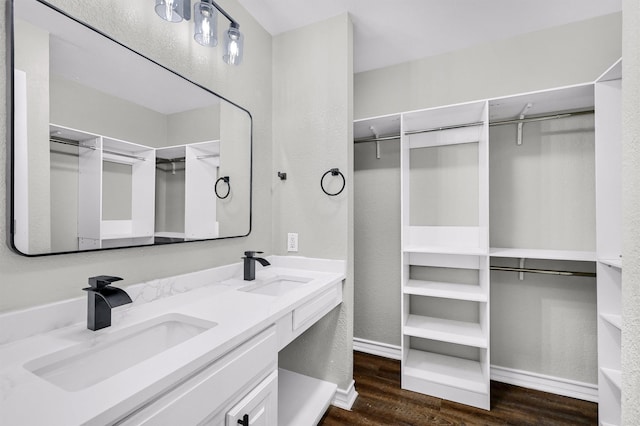 bathroom with vanity and hardwood / wood-style flooring