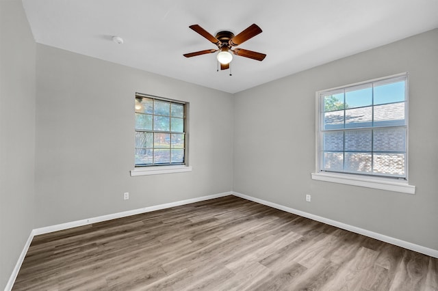 unfurnished room featuring ceiling fan and wood-type flooring