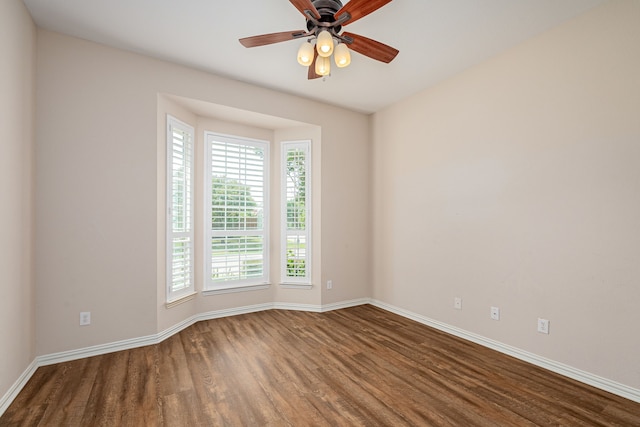 spare room with ceiling fan, hardwood / wood-style flooring, and plenty of natural light