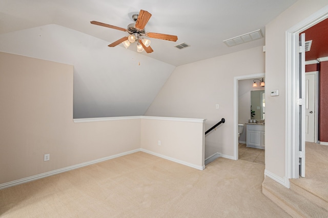 bonus room featuring vaulted ceiling, ceiling fan, and light colored carpet