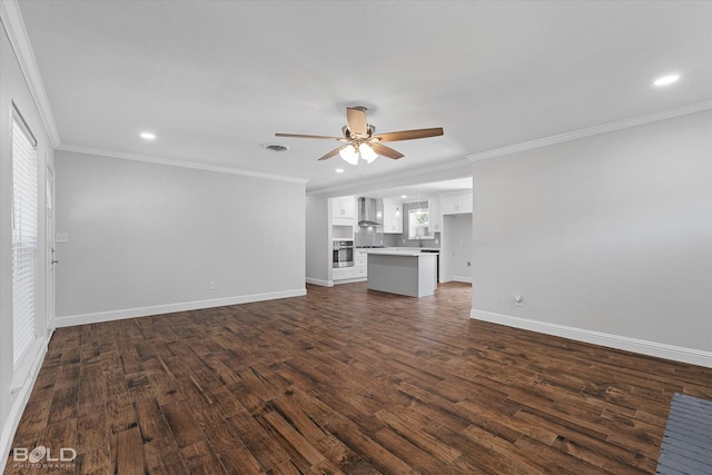 unfurnished living room featuring ornamental molding, ceiling fan, and dark hardwood / wood-style flooring