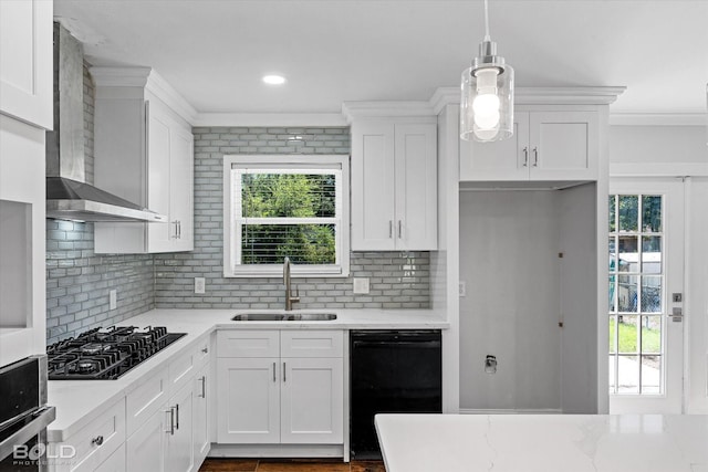 kitchen with sink, white cabinetry, decorative light fixtures, decorative backsplash, and black appliances