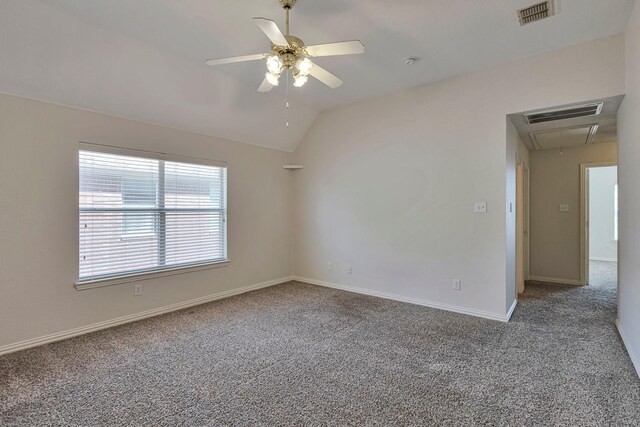 unfurnished bedroom with lofted ceiling, a closet, ceiling fan, and carpet flooring