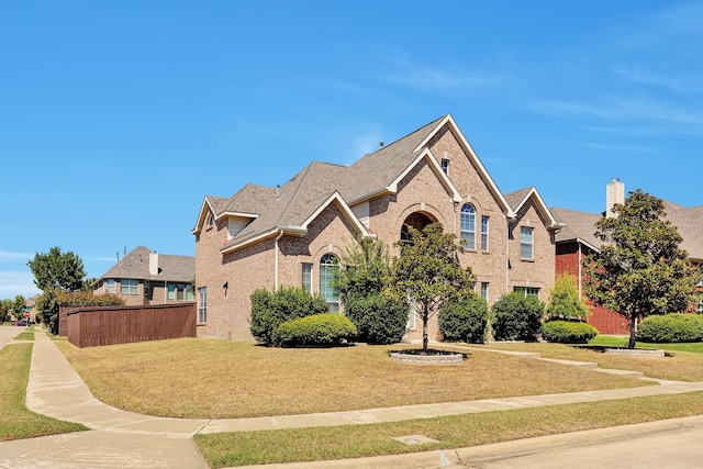 front facade featuring a front lawn