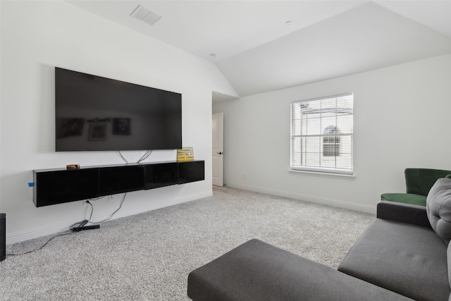 carpeted living room with lofted ceiling