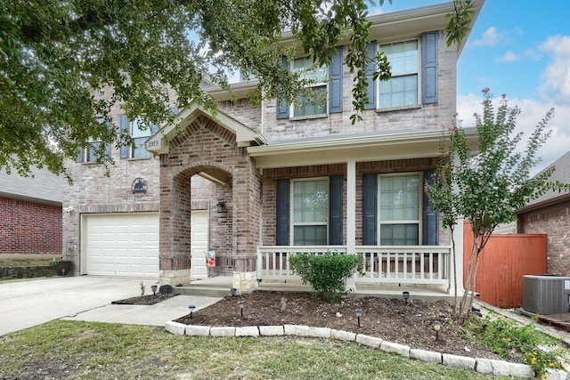 view of front of property featuring covered porch and a garage