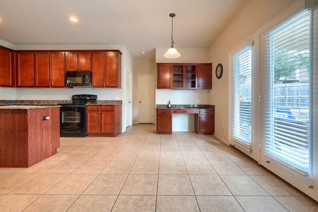 kitchen with black dishwasher, sink, light tile patterned flooring, dark stone counters, and stainless steel fridge with ice dispenser