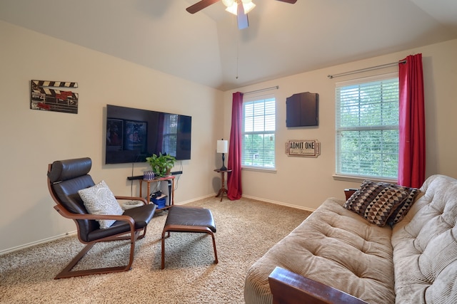 carpeted living room featuring ceiling fan and vaulted ceiling