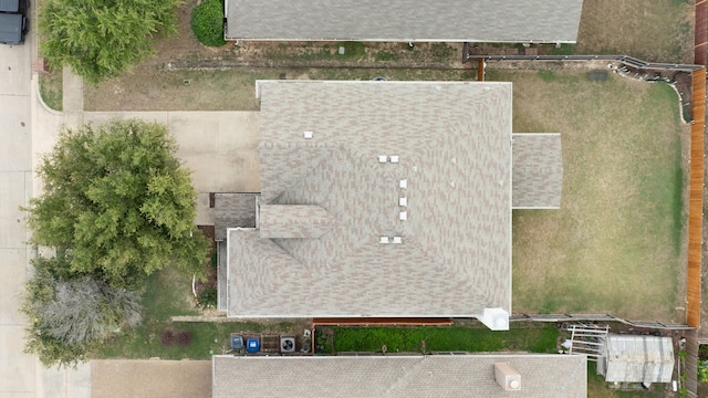 view of front facade featuring central AC, a garage, and a porch