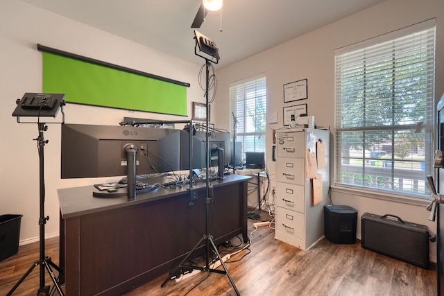 dining space featuring crown molding, wood-type flooring, and an inviting chandelier