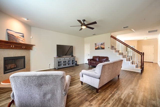 living room featuring hardwood / wood-style flooring and ceiling fan