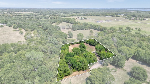 birds eye view of property with a rural view