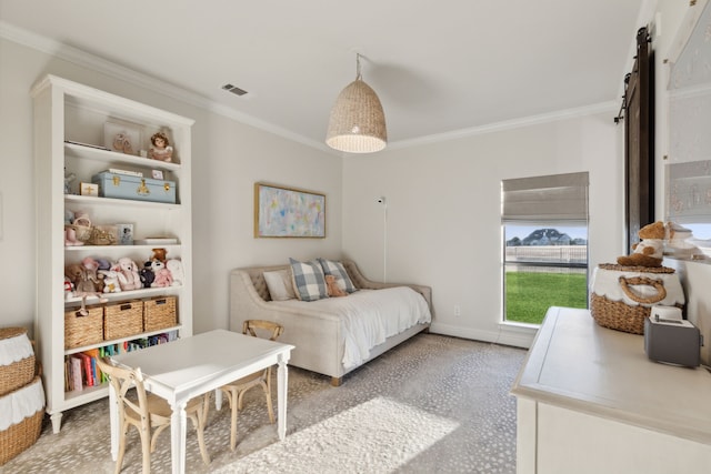 bedroom featuring a barn door and ornamental molding