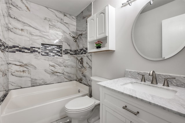 full bathroom featuring toilet, vanity, and tiled shower / bath combo