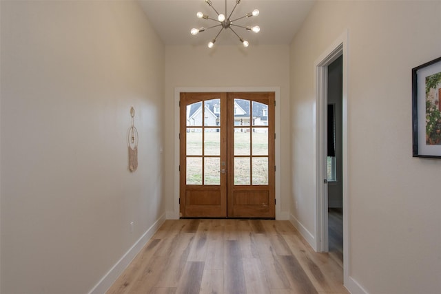 200 Splitrail Dr, Mabank, TX 75143 - entryway featuring an inviting chandelier, french doors, light wood-style flooring, and baseboards