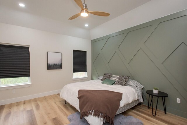 bedroom with ceiling fan and light wood-type flooring