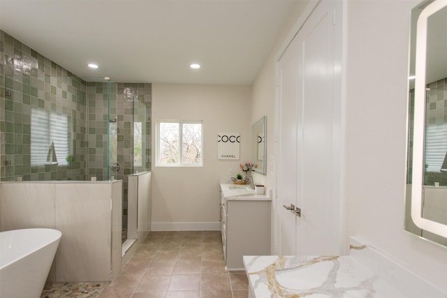 bathroom featuring tile patterned flooring, vanity, and independent shower and bath