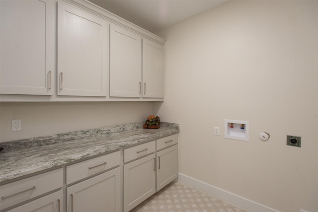 laundry room featuring hookup for an electric dryer, cabinets, and washer hookup