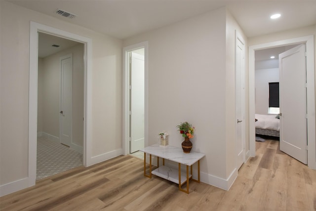 hall with light hardwood / wood-style flooring