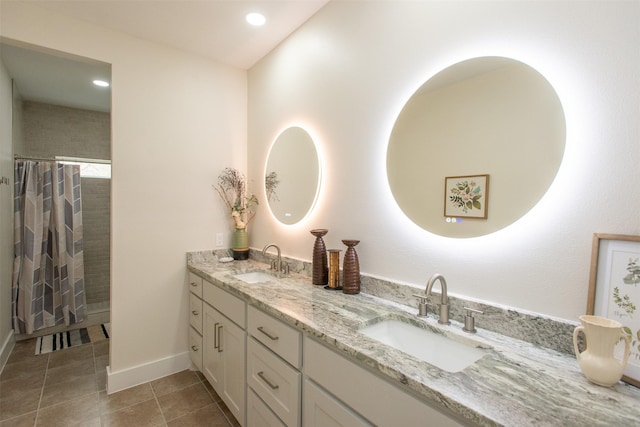 bathroom with tile patterned floors, a shower with curtain, and vanity