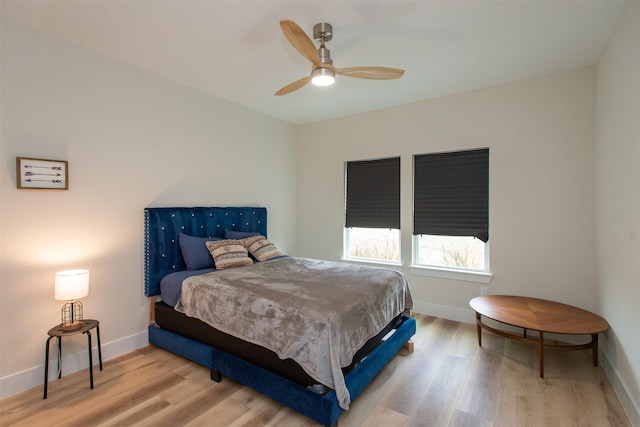 bedroom featuring ceiling fan and light hardwood / wood-style flooring