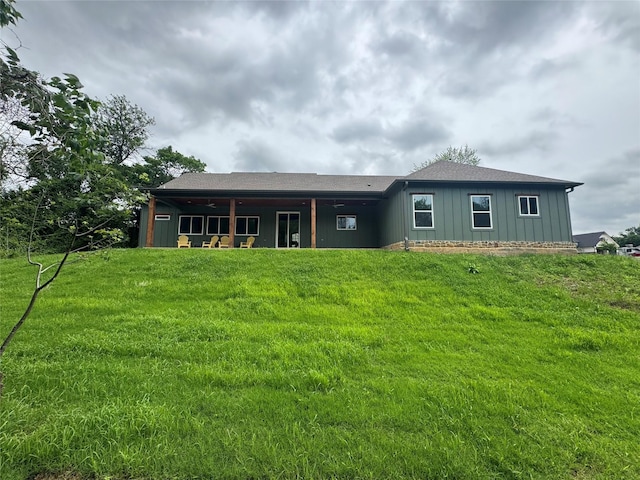 200 Splitrail Dr, Mabank, TX 75143 - rear view of property with board and batten siding and a lawn