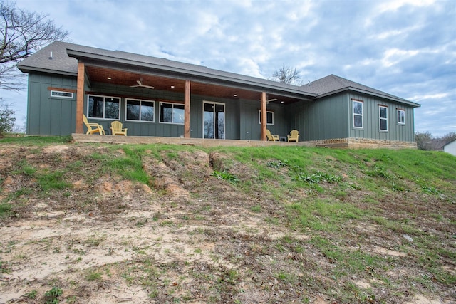 rear view of property with ceiling fan