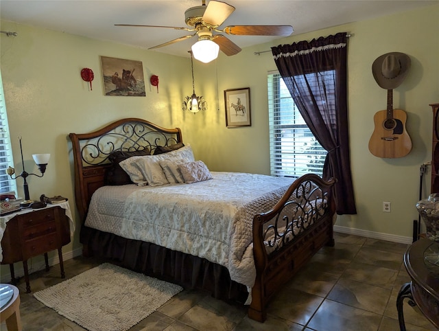 tiled bedroom with ceiling fan