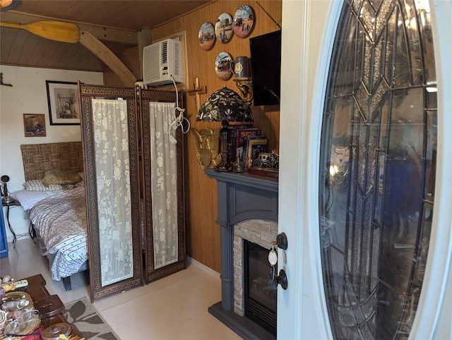 bathroom featuring ceiling fan, wood walls, and an AC wall unit