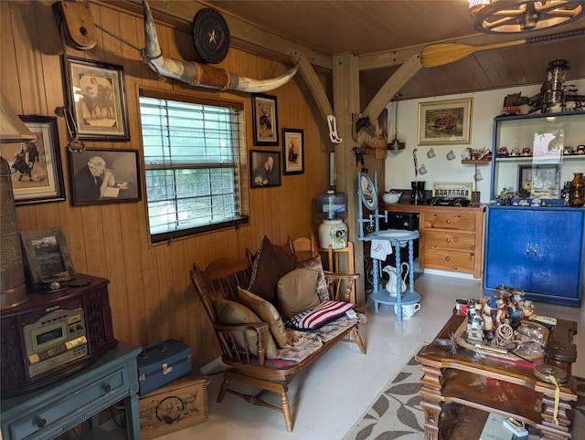 living room with wood walls and wood ceiling