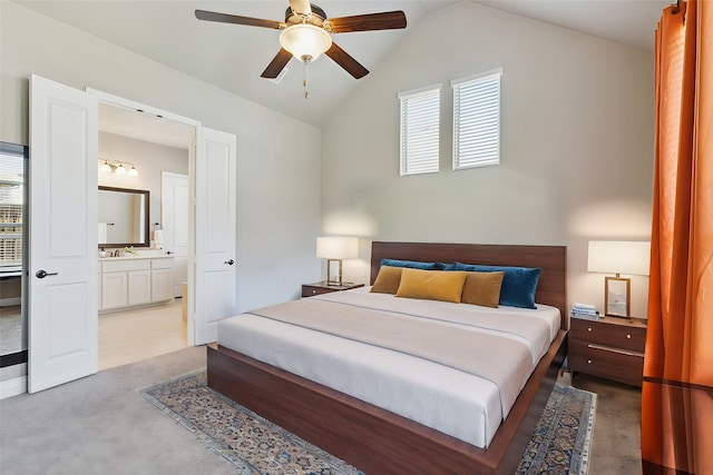 bedroom with ensuite bathroom, sink, lofted ceiling, carpet floors, and ceiling fan