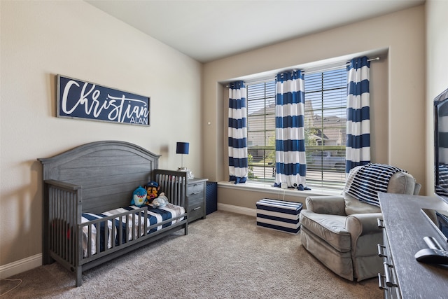 bedroom with light colored carpet and a crib