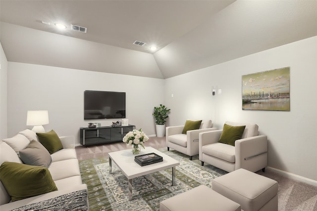 carpeted living room featuring vaulted ceiling